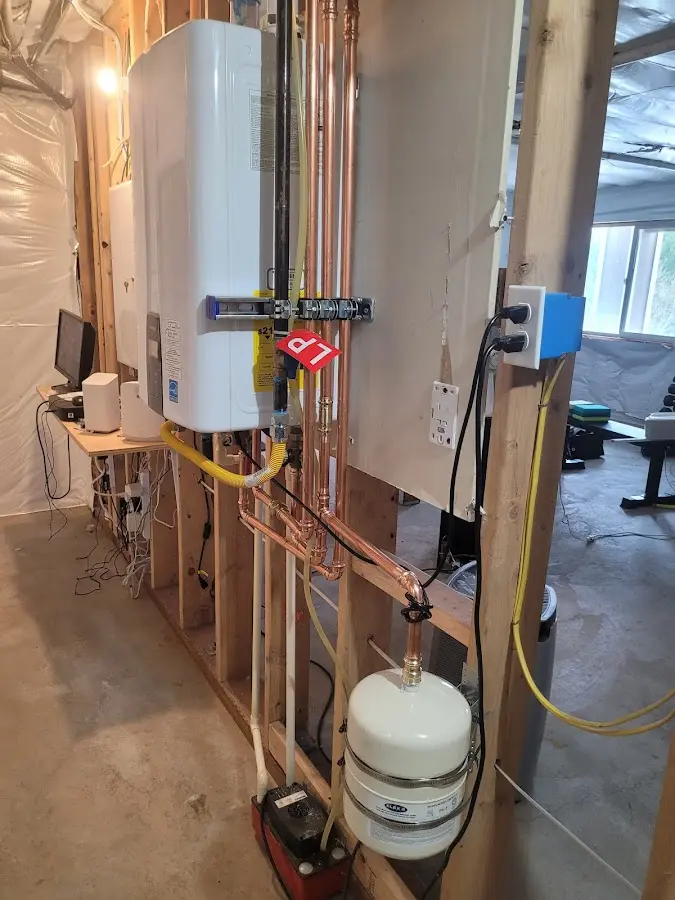 Licensed plumber repairing a kitchen sink in Angels